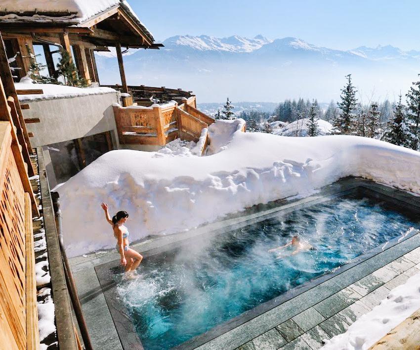 27 Outdoor Hot Springs, Tubs & Pools To Warm Up Your Winter Travels
